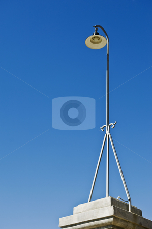 To use this stock image in your creative project, please select the size you need over to the right and click the "Add to Cart" button.
Your downloaded image will come with the Cutcaster watermark removed so don’t worry about the watermark you see on this page. Streetlight stock photo, Retro streetlight against a clear blue sky by Manuel Ribeiro