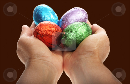 To use this stock image in your creative project, please select the size you need over to the right and click the "Add to Cart" button.
Your downloaded image will come with the Cutcaster watermark removed so don’t worry about the watermark you see on this page. Hands holding four Easter eggs stock photo, Two hands holding chocolate Easter eggs isolated with area for text by Christopher Meder