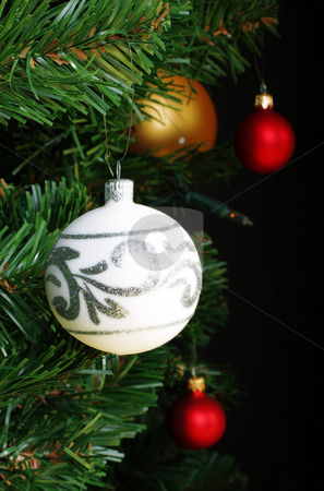 To use this stock image in your creative project, please select the size you need over to the right and click the "Add to Cart" button.
Your downloaded image will come with the Cutcaster watermark removed so don’t worry about the watermark you see on this page. Christmas decoration stock photo, Glass Christmas decoration on a green tree by Christopher Meder