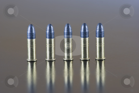 To use this stock image in your creative project, please select the size you need over to the right and click the "Add to Cart" button.
Your downloaded image will come with the Cutcaster watermark removed so don’t worry about the watermark you see on this page. Cartridges stock photo, Five 22 long rifle rimfire cartridge on a table by Serge VILLA