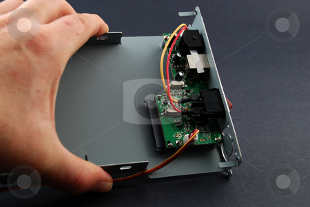 To use this stock image in your creative project, please select the size you need over to the right and click the "Add to Cart" button.
Your downloaded image will come with the Cutcaster watermark removed so don’t worry about the watermark you see on this page. Electronic parts and circuits stock photo, Pictures of the interior of a consumer electronics product showing the different components by Albert Lozano