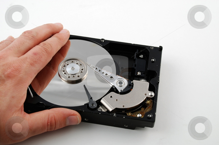 To use this stock image in your creative project, please select the size you need over to the right and click the "Add to Cart" button.
Your downloaded image will come with the Cutcaster watermark removed so don’t worry about the watermark you see on this page. Hard drive interior stock photo, Stock pictures of the interior of a compute hard drive by Albert Lozano