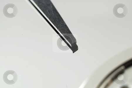 To use this stock image in your creative project, please select the size you need over to the right and click the "Add to Cart" button.
Your downloaded image will come with the Cutcaster watermark removed so don’t worry about the watermark you see on this page. Close up of hard drive stock photo, Close up pictures of the interior of a computer hard drive by Albert Lozano
