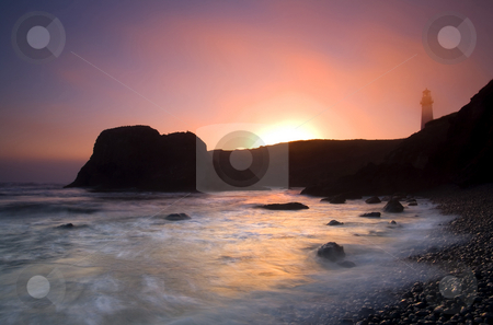 To use this stock image in your creative project, please select the size you need over to the right and click the "Add to Cart" button.
Your downloaded image will come with the Cutcaster watermark removed so don’t worry about the watermark you see on this page. From Light to Light stock photo, The sun sets on a foggy evening behing the Yaquina Head Lighthouse on the ORegon Coast by Mike Dawson