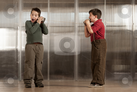 To use this stock image in your creative project, please select the size you need over to the right and click the "Add to Cart" button.
Your downloaded image will come with the Cutcaster watermark removed so don’t worry about the watermark you see on this page. Little boy getting shocking message on tin can phone stock photo, Little boy getting shocking message from friend on tin can phone by Scott Griessel