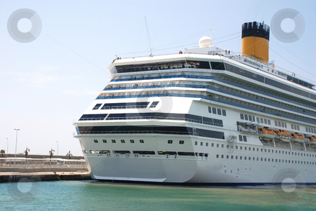 To use this stock image in your creative project, please select the size you need over to the right and click the "Add to Cart" button.
Your downloaded image will come with the Cutcaster watermark removed so don’t worry about the watermark you see on this page. Cruise ship stock photo, Pictures of a cruise ship docked at the harbor by Albert Lozano