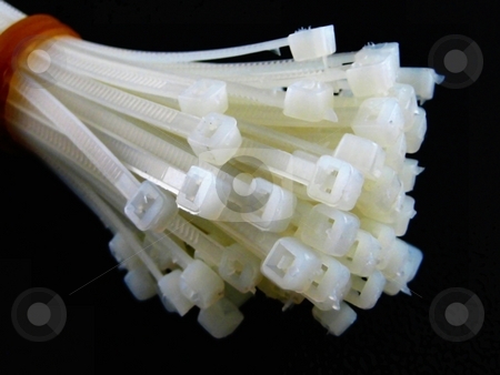 To use this stock image in your creative project, please select the size you need over to the right and click the "Add to Cart" button.
Your downloaded image will come with the Cutcaster watermark removed so don’t worry about the watermark you see on this page. Cable ties stock photo, Ties to arrange cables for electronic equipment by Albert Lozano