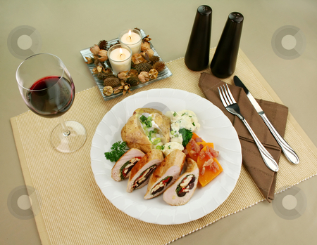 To use this stock image in your creative project, please select the size you need over to the right and click the "Add to Cart" button.
Your downloaded image will come with the Cutcaster watermark removed so don’t worry about the watermark you see on this page. Stuffed Chicken stock photo, Chicken stuffed with a Mediterranean filling made of spinach, fetta, peppers and olives with vegetables. by Brett Mulcahy