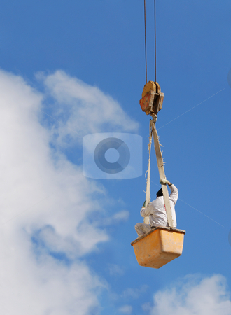 To use this stock image in your creative project, please select the size you need over to the right and click the "Add to Cart" button.
Your downloaded image will come with the Cutcaster watermark removed so don’t worry about the watermark you see on this page. Worker in air stock photo, A worker hanging on a steel cable. by Ivan Paunovic