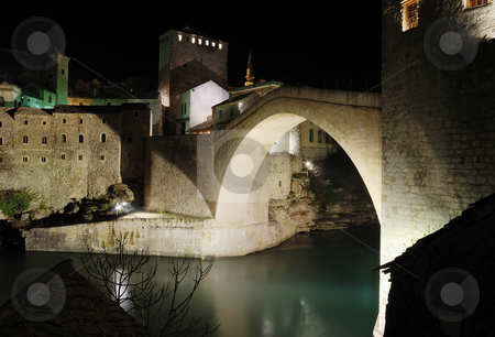 To use this stock image in your creative project, please select the size you need over to the right and click the "Add to Cart" button.
Your downloaded image will come with the Cutcaster watermark removed so don’t worry about the watermark you see on this page. Old Bridge by night stock photo, Famous Old Bridge in Mostar by night. by Ivan Paunovic