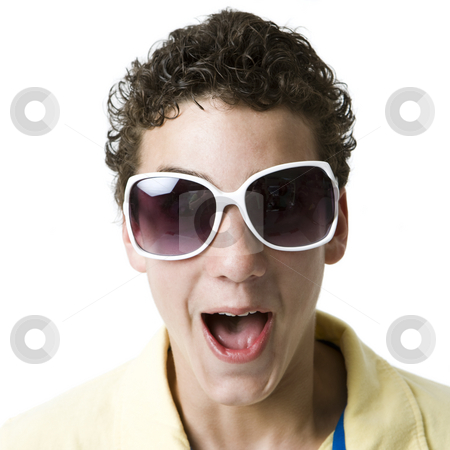 To use this stock image in your creative project, please select the size you need over to the right and click the "Add to Cart" button.
Your downloaded image will come with the Cutcaster watermark removed so don’t worry about the watermark you see on this page. Kid with funky glasses stock photo, A boy with funky white sunglasses screams by Rick Becker-Leckrone