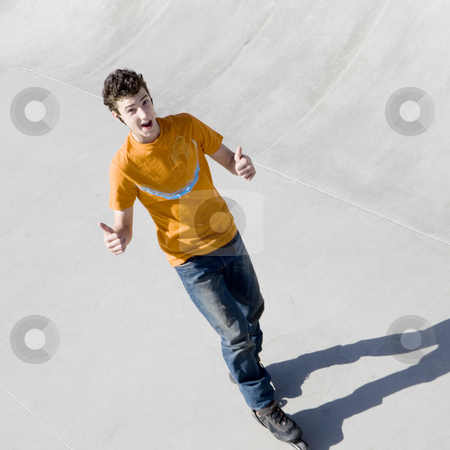To use this stock image in your creative project, please select the size you need over to the right and click the "Add to Cart" button.
Your downloaded image will come with the Cutcaster watermark removed so don’t worry about the watermark you see on this page. Rollerblader in skatepark stock photo, Rollerblader in skatepark gestures a thumbs-up by Rick Becker-Leckrone