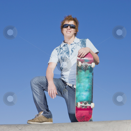 To use this stock image in your creative project, please select the size you need over to the right and click the "Add to Cart" button.
Your downloaded image will come with the Cutcaster watermark removed so don’t worry about the watermark you see on this page. Teen skater atop ramp stock photo, Teen skater kneels atop ramp by Rick Becker-Leckrone