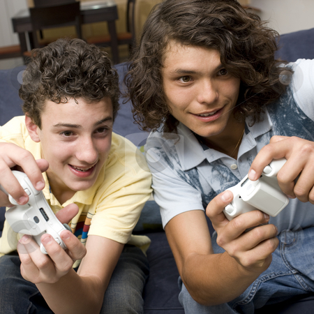 To use this stock image in your creative project, please select the size you need over to the right and click the "Add to Cart" button.
Your downloaded image will come with the Cutcaster watermark removed so don’t worry about the watermark you see on this page. Two guys play videogames stock photo, Two guys play videogames on a couch by Rick Becker-Leckrone