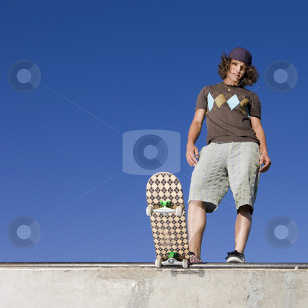 To use this stock image in your creative project, please select the size you need over to the right and click the "Add to Cart" button.
Your downloaded image will come with the Cutcaster watermark removed so don’t worry about the watermark you see on this page. Skater at halfpipe stock photo, Skateboarder at top of half pipe by Rick Becker-Leckrone