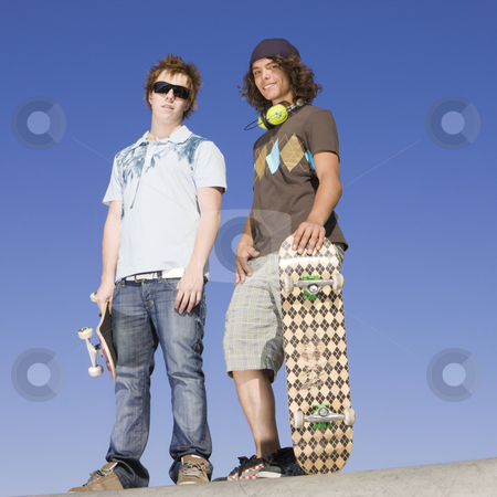 To use this stock image in your creative project, please select the size you need over to the right and click the "Add to Cart" button.
Your downloaded image will come with the Cutcaster watermark removed so don’t worry about the watermark you see on this page. Teen skaters atop ramp stock photo, Two teen skaters atop ramp by Rick Becker-Leckrone