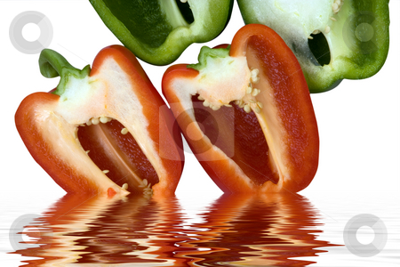 To use this stock image in your creative project, please select the size you need over to the right and click the "Add to Cart" button.
Your downloaded image will come with the Cutcaster watermark removed so don’t worry about the watermark you see on this page. Red and green stock photo, Red and green peppers sliced in half, going into water by Paul Phillips