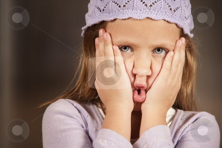 To use this stock image in your creative project, please select the size you need over to the right and click the "Add to Cart" button.
Your downloaded image will come with the Cutcaster watermark removed so don’t worry about the watermark you see on this page. Young girl making a funny face stock photo, Cute young girl in a knit cap making funny face by Scott Griessel