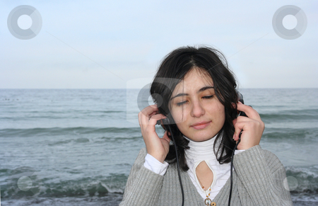 To use this stock image in your creative project, please select the size you need over to the right and click the "Add to Cart" button.
Your downloaded image will come with the Cutcaster watermark removed so don’t worry about the watermark you see on this page. Sea voice stock photo, The girl has closed eyes and hears the sea by Aleksandr GAvrilov