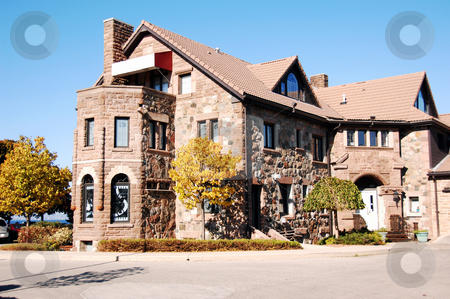 To use this stock image in your creative project, please select the size you need over to the right and click the "Add to Cart" button.
Your downloaded image will come with the Cutcaster watermark removed so don’t worry about the watermark you see on this page. Old restaurant stock photo, An old restaurant in the fall an the lake Ontario with heavy stone walls. by Horst Petzold