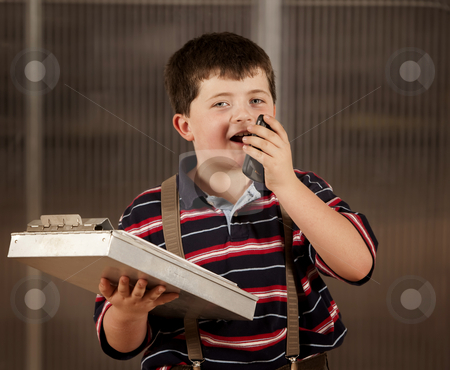 To use this stock image in your creative project, please select the size you need over to the right and click the "Add to Cart" button.
Your downloaded image will come with the Cutcaster watermark removed so don’t worry about the watermark you see on this page. Little boy in adult clothes on cell phone stock photo, Handsome young boy in adult business clothes on phone by Scott Griessel