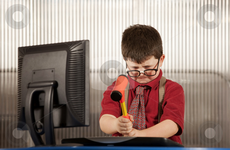 To use this stock image in your creative project, please select the size you need over to the right and click the "Add to Cart" button.
Your downloaded image will come with the Cutcaster watermark removed so don’t worry about the watermark you see on this page. Nerdy boy smashing his computer stock photo, Nerdy young boy smashing his computer with a hammer by Scott Griessel