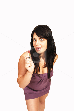 To use this stock image in your creative project, please select the size you need over to the right and click the "Add to Cart" button.
Your downloaded image will come with the Cutcaster watermark removed so don’t worry about the watermark you see on this page. Standing woman in pink dress. stock photo, An friendly girl in an short pink dress standing in an studio and putting
new lipstick on, for white background. by Horst Petzold