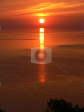 To use this stock image in your creative project, please select the size you need over to the right and click the "Add to Cart" button.
Your downloaded image will come with the Cutcaster watermark removed so don’t worry about the watermark you see on this page. Sunrise over the lake stock photo, The sun rises early in the morning over lake Ontario. by Horst Petzold