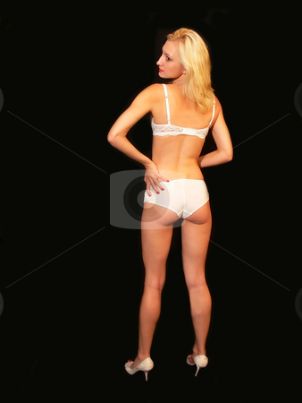 To use this stock image in your creative project, please select the size you need over to the right and click the "Add to Cart" button.
Your downloaded image will come with the Cutcaster watermark removed so don’t worry about the watermark you see on this page. Girl in underwear. stock photo, A pretty blond girl in white underwear for black background. by Horst Petzold