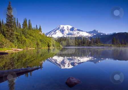 To use this stock image in your creative project, please select the size you need over to the right and click the "Add to Cart" button.
Your downloaded image will come with the Cutcaster watermark removed so don’t worry about the watermark you see on this page. Morning Calm stock photo, The still waters of Bench LAke reflect the pristine slolpes of Mt. Rainier by Mike Dawson