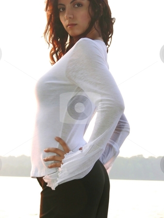 To use this stock image in your creative project, please select the size you need over to the right and click the "Add to Cart" button.
Your downloaded image will come with the Cutcaster watermark removed so don’t worry about the watermark you see on this page. Lady on the lake stock photo, A beautiful young girl standing on the lake and enjoying the sunset in close-up. by Horst Petzold
