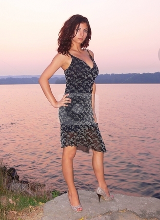 To use this stock image in your creative project, please select the size you need over to the right and click the "Add to Cart" button.
Your downloaded image will come with the Cutcaster watermark removed so don’t worry about the watermark you see on this page. Pretty girl on the lake stock photo, A young girl is standing on a rock on the lake in an beautiful sunset. by Horst Petzold