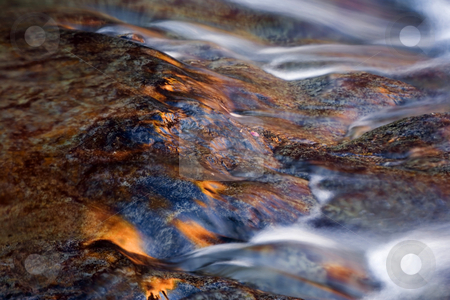 To use this stock image in your creative project, please select the size you need over to the right and click the "Add to Cart" button.
Your downloaded image will come with the Cutcaster watermark removed so don’t worry about the watermark you see on this page. Reflections of Sunset stock photo, A bit of sunset reflection off the wet rocks as the Little Naches River flows by. by Mike Dawson