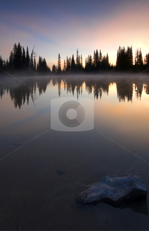To use this stock image in your creative project, please select the size you need over to the right and click the "Add to Cart" button.
Your downloaded image will come with the Cutcaster watermark removed so don’t worry about the watermark you see on this page. Burining Sunrise stock photo, A brilliant dawn reflecting in the still waters of an alpine lake near Mt. Rainier by Mike Dawson