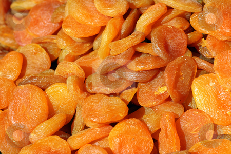 To use this stock image in your creative project, please select the size you need over to the right and click the "Add to Cart" button.
Your downloaded image will come with the Cutcaster watermark removed so don’t worry about the watermark you see on this page. Dried apricot background stock photo, Orange background of dried sweet apricots on a market by Natalia Macheda