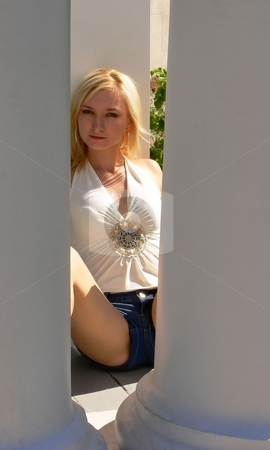 To use this stock image in your creative project, please select the size you need over to the right and click the "Add to Cart" button.
Your downloaded image will come with the Cutcaster watermark removed so don’t worry about the watermark you see on this page. Young lady in jeans. stock photo, An young lady in short jeans and a white top sitting on the floor and
looking through two big white columns. by Horst Petzold