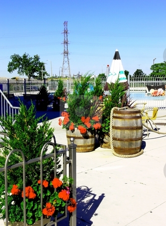 To use this stock image in your creative project, please select the size you need over to the right and click the "Add to Cart" button.
Your downloaded image will come with the Cutcaster watermark removed so don’t worry about the watermark you see on this page. Patio restaurant. stock photo, An nice patio restaurant with an pool an beautiful flowers. by Horst Petzold
