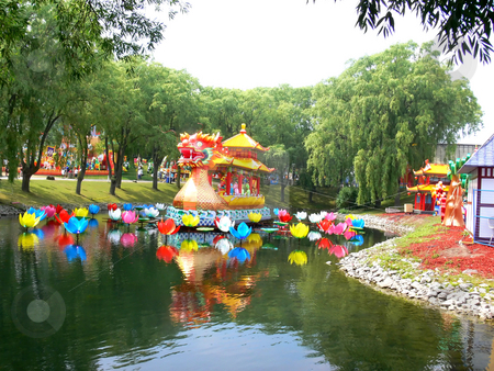 To use this stock image in your creative project, please select the size you need over to the right and click the "Add to Cart" button.
Your downloaded image will come with the Cutcaster watermark removed so don’t worry about the watermark you see on this page. Chinese festival. stock photo, An Chinese festival of the island from Ontario Place in Toronto.
Beautiful colorful flowers and there reflection in the water. by Horst Petzold