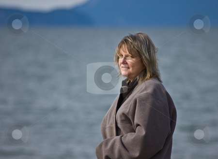 To use this stock image in your creative project, please select the size you need over to the right and click the "Add to Cart" button.
Your downloaded image will come with the Cutcaster watermark removed so don’t worry about the watermark you see on this page. Middle Aged Blond Woman At Ocean stock photo, Middle aged blond woman is looking out over the ocean contemplating and dreaming in this open shot. by Valerie Garner