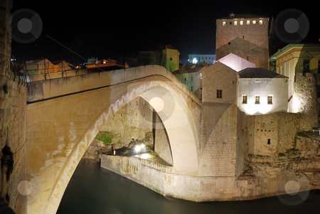 To use this stock image in your creative project, please select the size you need over to the right and click the "Add to Cart" button.
Your downloaded image will come with the Cutcaster watermark removed so don’t worry about the watermark you see on this page. Mostar Old Bridge at Night stock photo, Old Bridge in Mostar at night reconstructed in 2003 after the original from 1556. by Denis Radovanovic