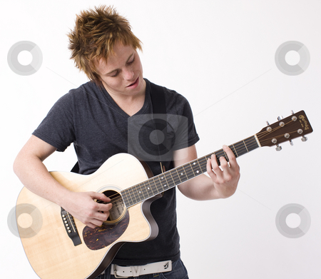 To use this stock image in your creative project, please select the size you need over to the right and click the "Add to Cart" button.
Your downloaded image will come with the Cutcaster watermark removed so don’t worry about the watermark you see on this page. Boy plays guitar stock photo, A boy plays acoustic guitar by Rick Becker-Leckrone