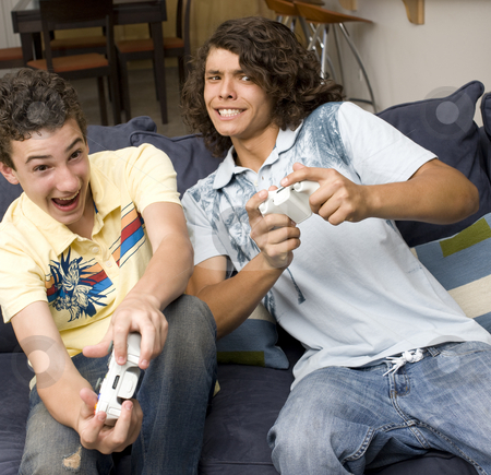 To use this stock image in your creative project, please select the size you need over to the right and click the "Add to Cart" button.
Your downloaded image will come with the Cutcaster watermark removed so don’t worry about the watermark you see on this page. Two guys play videogames stock photo, Two guys play videogames on a couch by Rick Becker-Leckrone