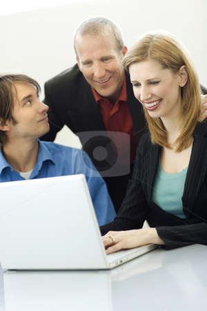 To use this stock image in your creative project, please select the size you need over to the right and click the "Add to Cart" button.
Your downloaded image will come with the Cutcaster watermark removed so don’t worry about the watermark you see on this page. Three workers talk stock photo, Three workers talk while using a laptop by Rick Becker-Leckrone