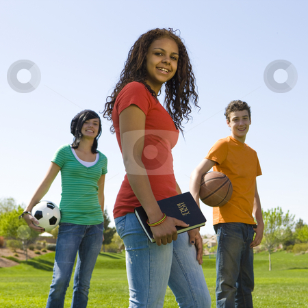 To use this stock image in your creative project, please select the size you need over to the right and click the "Add to Cart" button.
Your downloaded image will come with the Cutcaster watermark removed so don’t worry about the watermark you see on this page. Three teens with bible stock photo, Three teens with bible hang out at a park by Rick Becker-Leckrone