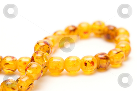 To use this stock image in your creative project, please select the size you need over to the right and click the "Add to Cart" button.
Your downloaded image will come with the Cutcaster watermark removed so don’t worry about the watermark you see on this page. Amber beads stock photo, Amber beads by Andrey Butenko