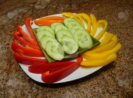 To use this stock image in your creative project, please select the size you need over to the right and click the "Add to Cart" button.
Your downloaded image will come with the Cutcaster watermark removed so don’t worry about the watermark you see on this page. Sweet bell peppers and cucumbers stock photo, Plate with an arrangement of red, yellow and orange bell pappers and sliced cucumbers by Jill Reid