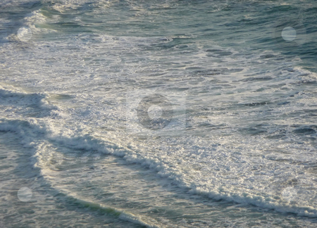 To use this stock image in your creative project, please select the size you need over to the right and click the "Add to Cart" button.
Your downloaded image will come with the Cutcaster watermark removed so don’t worry about the watermark you see on this page. Foaming gentle waves along the coast 250A stock photo, Foamy gentle waves roll into shore, lit by the sun by Jill Reid