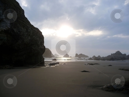 To use this stock image in your creative project, please select the size you need over to the right and click the "Add to Cart" button.
Your downloaded image will come with the Cutcaster watermark removed so don’t worry about the watermark you see on this page. Afternoon sun glares on a rocky beach stock photo, The afternoon sun glares through the clouds onto a sandy beach by Jill Reid