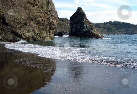 To use this stock image in your creative project, please select the size you need over to the right and click the "Add to Cart" button.
Your downloaded image will come with the Cutcaster watermark removed so don’t worry about the watermark you see on this page. Reflections of sky and rocks along the coast stock photo, Gentle surf and wet sand reflect the sky and rocks on a sandy coast by Jill Reid