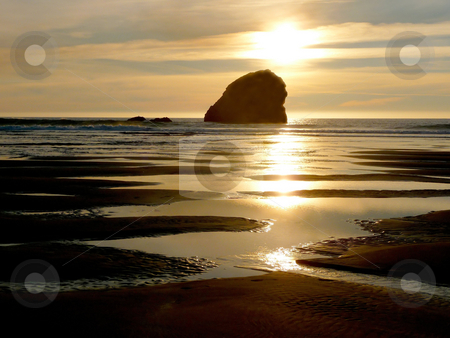To use this stock image in your creative project, please select the size you need over to the right and click the "Add to Cart" button.
Your downloaded image will come with the Cutcaster watermark removed so don’t worry about the watermark you see on this page. Coastal Sunset with rock formation stock photo, An evening sunset on the coast with reflective pools of water and sand and outlying rock formation by Jill Reid
